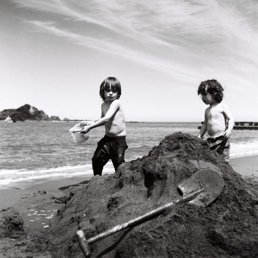 Kids at Island Bay: A little dude called Che and his buddy building a sandcastle.