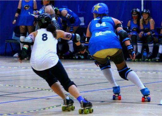 Anna Wong blocking against Swamp City's Blue Blaze: 